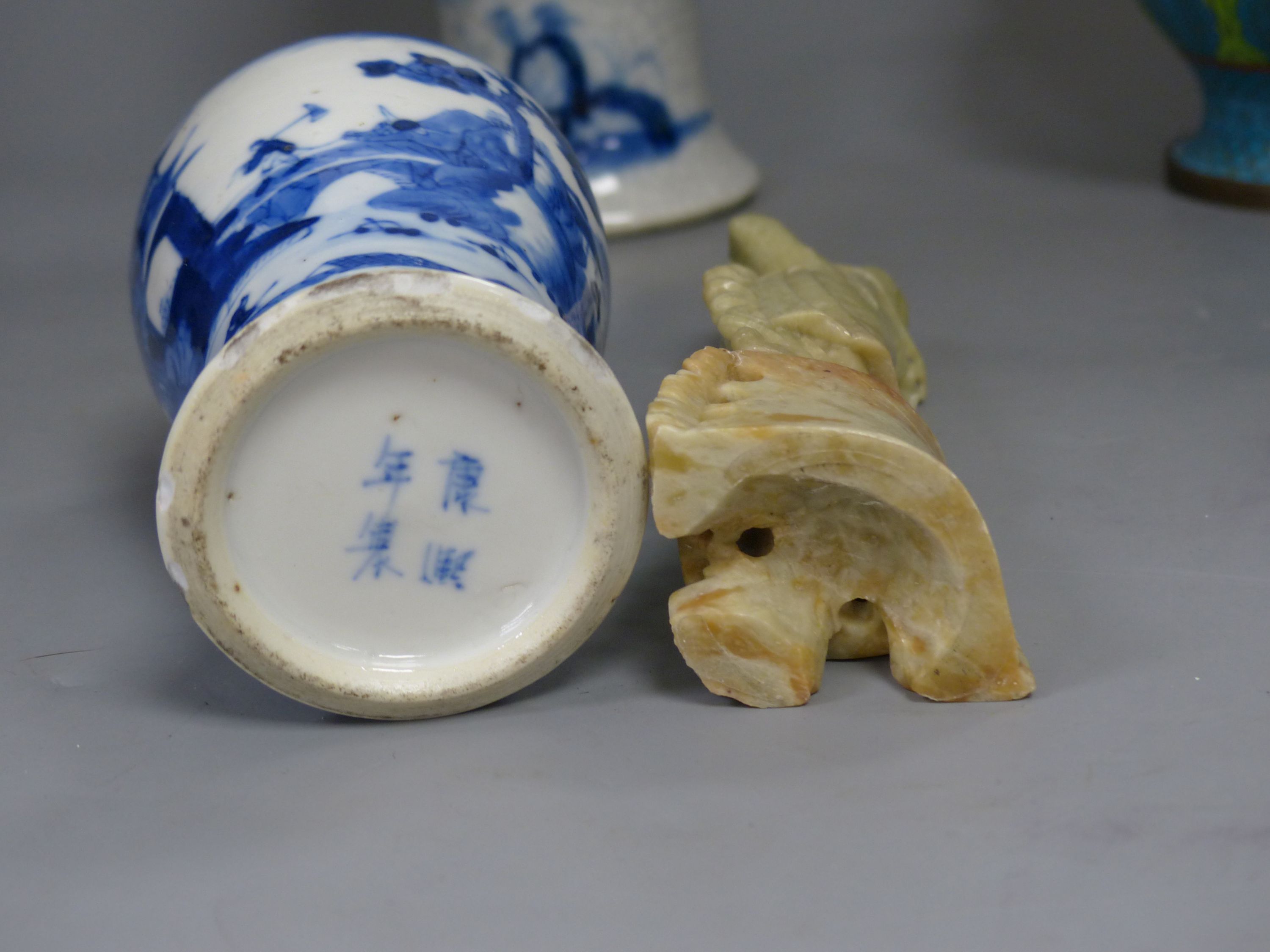 Three Chinese blue and white vases, a cloisonne enamel vase, another vase and a soapstone figure